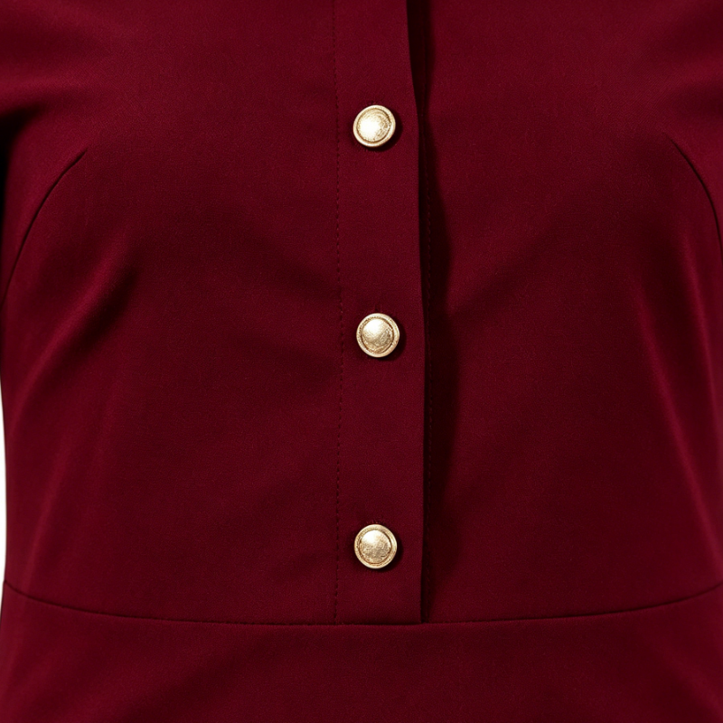 Sophisticated burgundy shirt-collar dress with a fitted waist and ruffled hem
